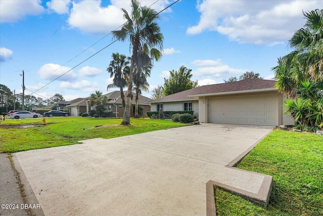 view of front facade featuring a front yard and a garage