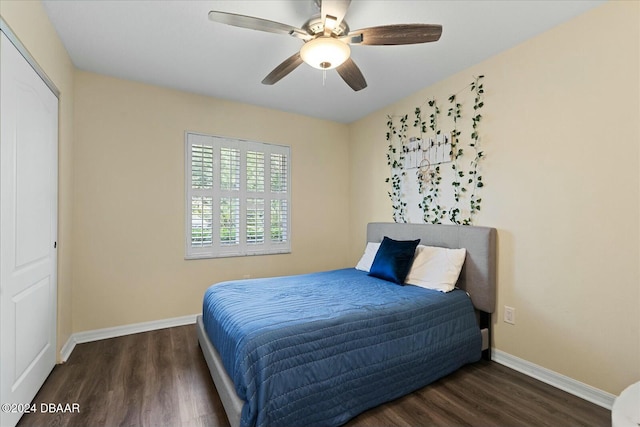 bedroom featuring a closet, dark wood-type flooring, and ceiling fan