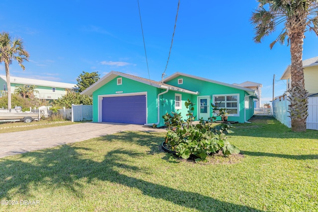 view of front facade featuring a front yard and a garage