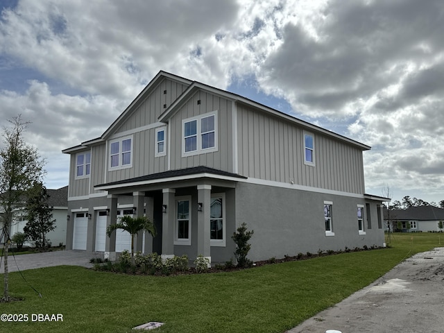 view of front of house with a garage and a front yard