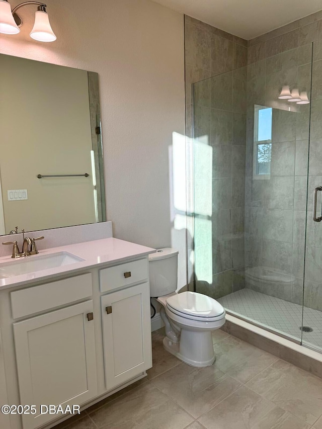 bathroom featuring vanity, toilet, and an enclosed shower