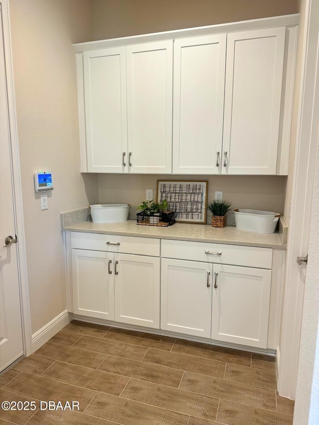 bar featuring white cabinetry