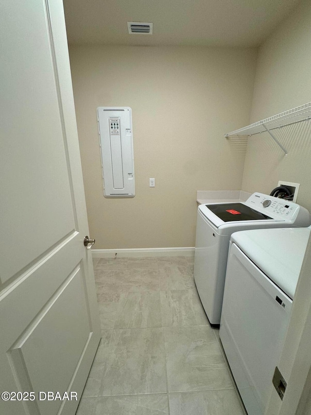 laundry area with separate washer and dryer