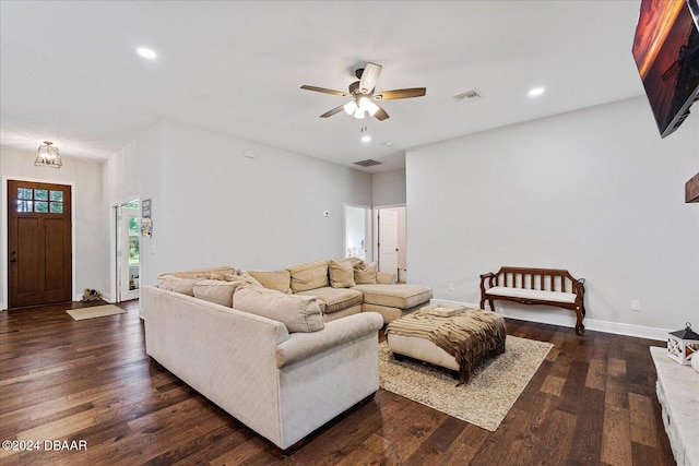 living room featuring dark hardwood / wood-style flooring and ceiling fan