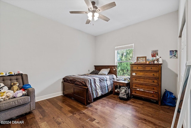 bedroom featuring dark wood-type flooring and ceiling fan