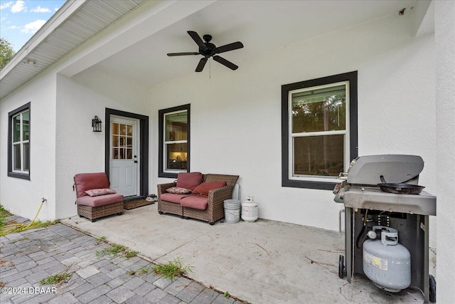 view of patio / terrace featuring a grill and ceiling fan