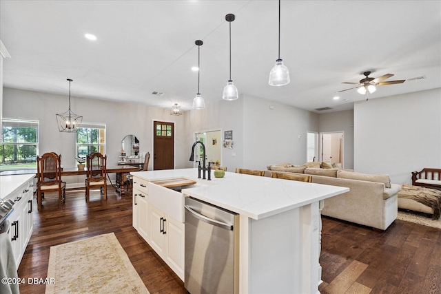 kitchen with dishwasher, a kitchen island with sink, dark wood-type flooring, and decorative light fixtures