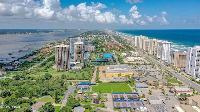 drone / aerial view featuring a view of city and a water view