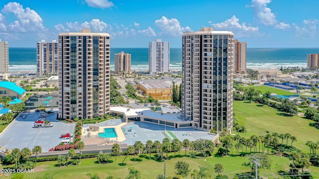 birds eye view of property featuring a water view and view of golf course