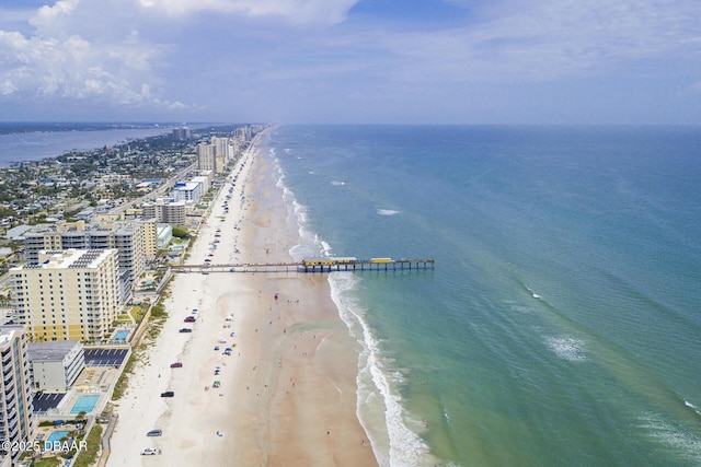aerial view featuring a water view and a view of the beach