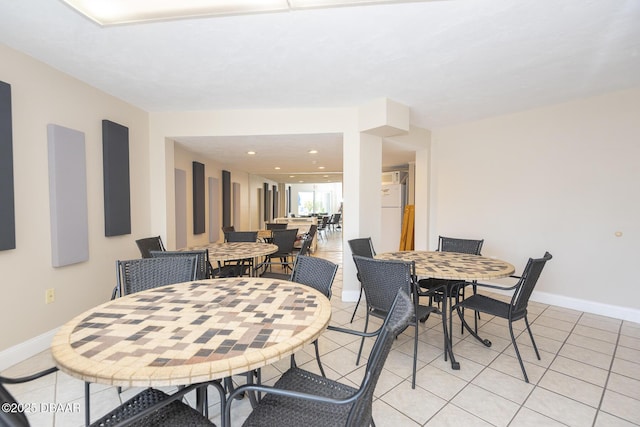 dining room with recessed lighting, baseboards, and light tile patterned floors