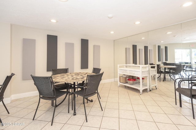 dining space featuring recessed lighting, baseboards, and light tile patterned floors