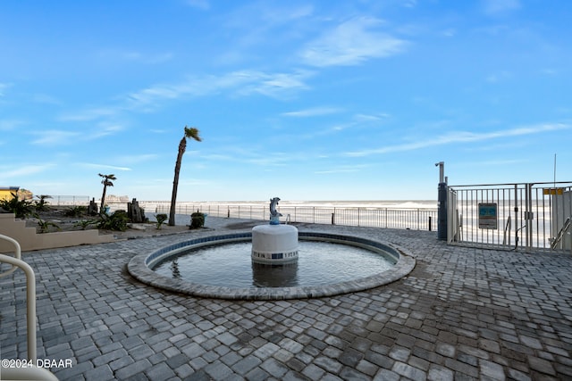 view of patio / terrace with a water view