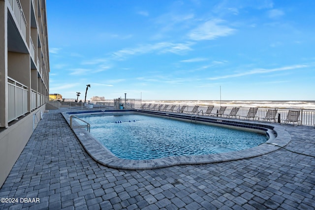219 S Atlantic Ave Unit 402, Daytona Beach, FL 32118 - community pool with a patio area and fence