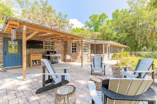 view of patio featuring grilling area and an outdoor fire pit