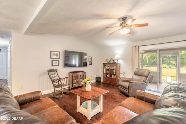 living room featuring wood finished floors, a ceiling fan, baseboards, and lofted ceiling