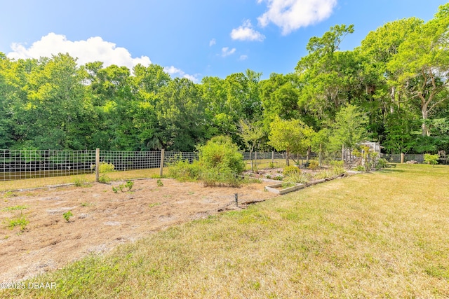 view of yard featuring a garden and fence