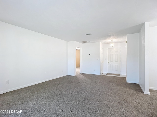 unfurnished room featuring carpet