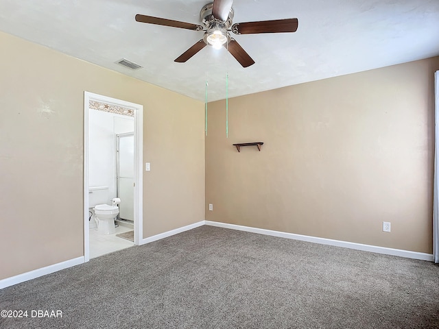 unfurnished bedroom with light carpet, ceiling fan, and ensuite bath