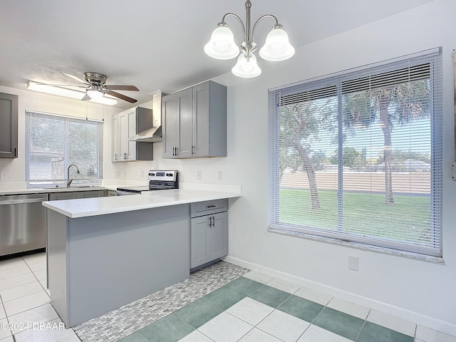 kitchen featuring dishwasher, electric stove, decorative light fixtures, and a healthy amount of sunlight