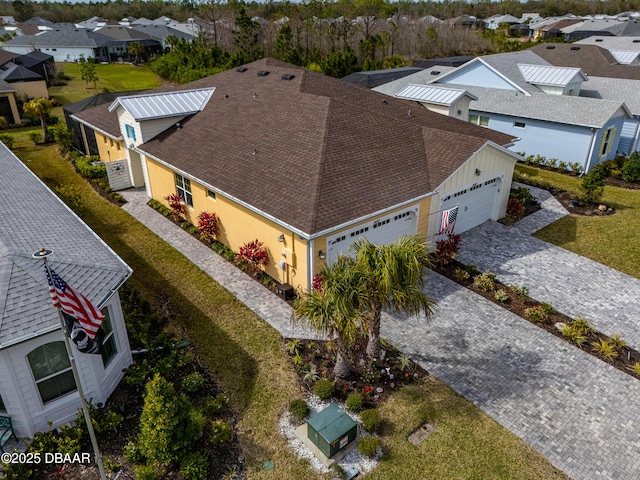 birds eye view of property with a residential view