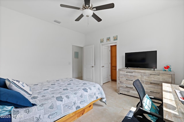 bedroom with light tile patterned floors, visible vents, and a ceiling fan