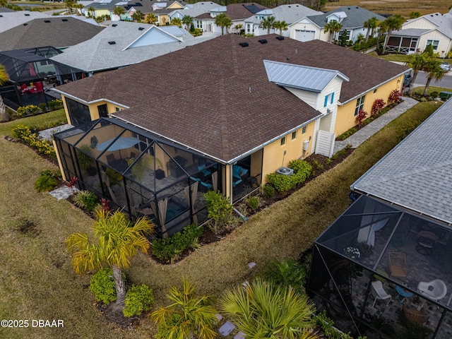 birds eye view of property with a residential view