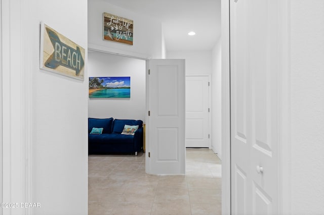 corridor with light tile patterned flooring