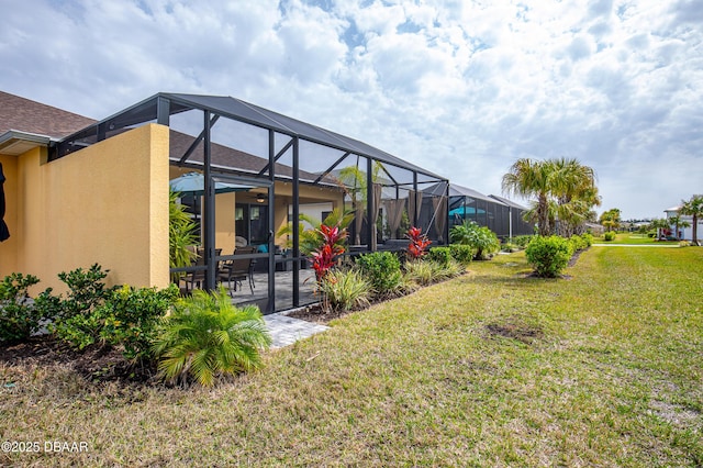 view of yard with a patio and a lanai