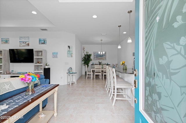 living area featuring an inviting chandelier, light tile patterned floors, recessed lighting, and visible vents