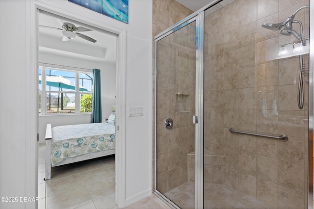 bathroom with tile patterned flooring, ensuite bath, a ceiling fan, and a shower stall