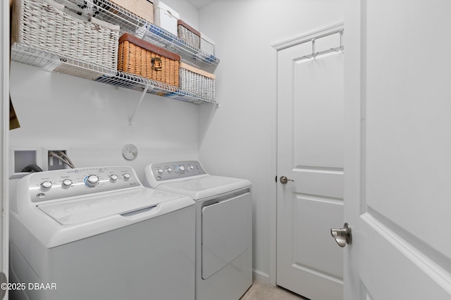 laundry area featuring laundry area and washing machine and dryer