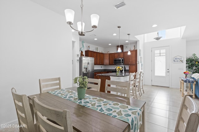 dining area featuring visible vents, baseboards, a chandelier, light tile patterned floors, and recessed lighting