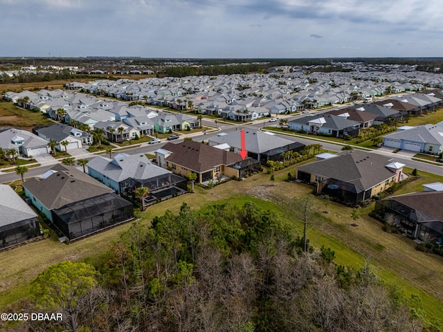 birds eye view of property with a residential view