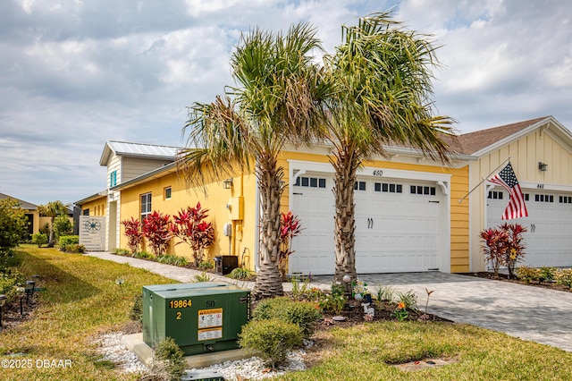 view of front of property featuring decorative driveway and board and batten siding