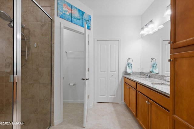 bathroom with a sink, double vanity, and a shower stall