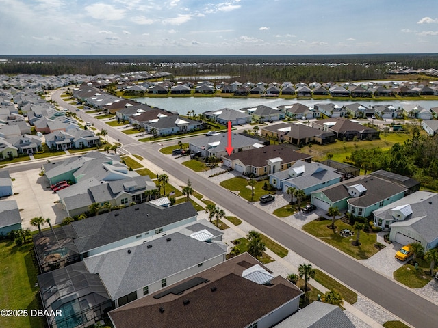 birds eye view of property featuring a residential view and a water view