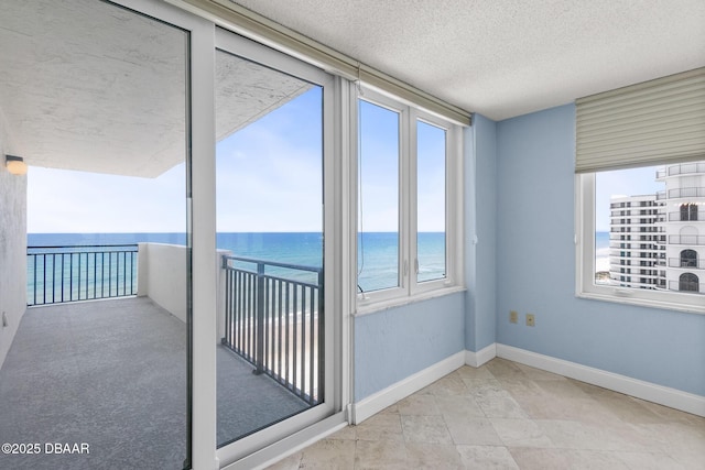 2987 S Atlantic Ave Unit 903, Daytona Beach Shores, FL 32118 - unfurnished sunroom with a water view