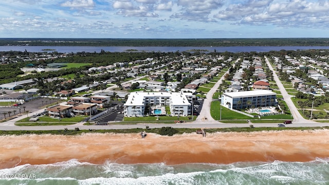 aerial view with a view of the beach and a water view