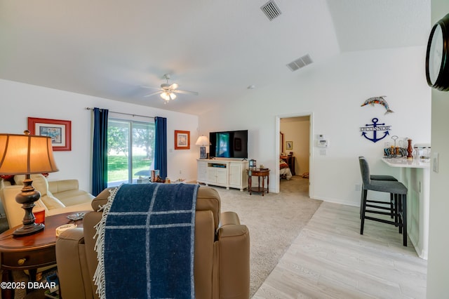49 Felshire Ln, Palm Coast, FL 32137 - living area with vaulted ceiling, ceiling fan, and light wood-style flooring
