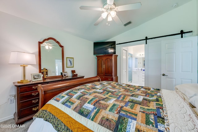 49 Felshire Ln, Palm Coast, FL 32137 - bedroom featuring a barn door, vaulted ceiling, carpet flooring, a ceiling fan, and ensuite bathroom