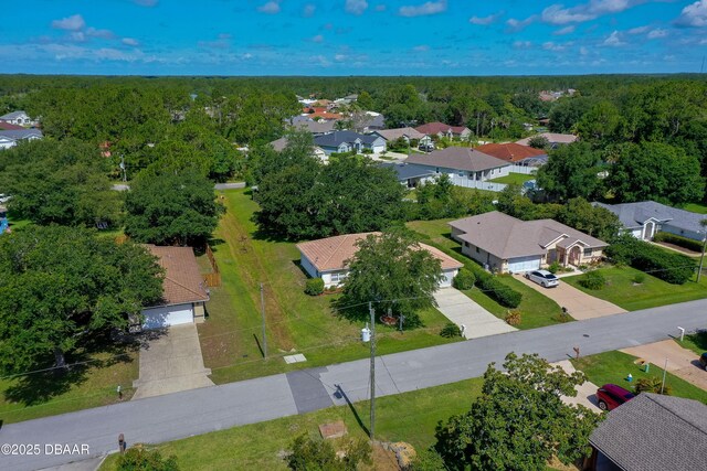 49 Felshire Ln, Palm Coast, FL 32137 - aerial perspective of suburban area with a forest