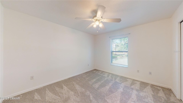 49 Felshire Ln, Palm Coast, FL 32137 - unfurnished room with light carpet, ceiling fan, and baseboards