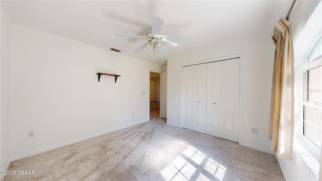 49 Felshire Ln, Palm Coast, FL 32137 - unfurnished bedroom featuring carpet, a closet, and baseboards