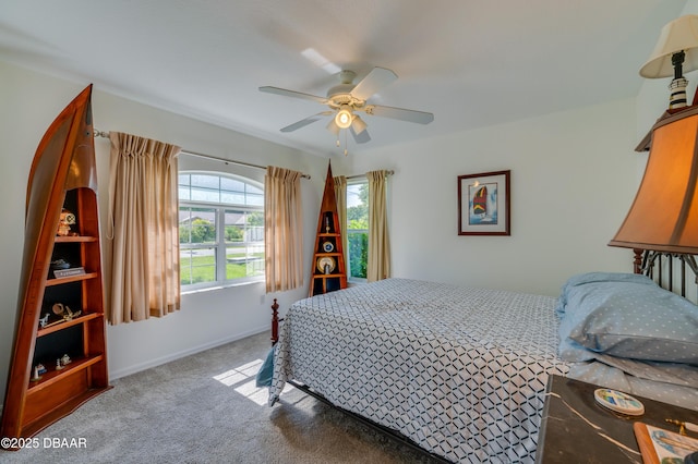 49 Felshire Ln, Palm Coast, FL 32137 - carpeted bedroom with a ceiling fan and baseboards