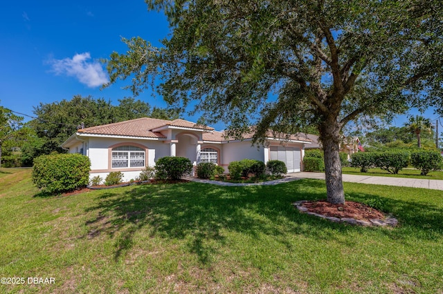 49 Felshire Ln, Palm Coast, FL 32137 - mediterranean / spanish home featuring a garage, driveway, stucco siding, and a front yard