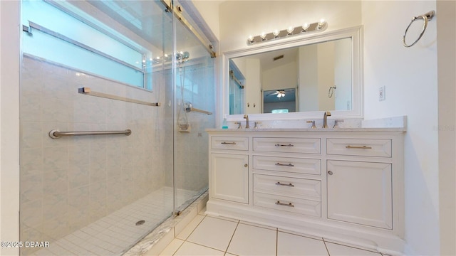 49 Felshire Ln, Palm Coast, FL 32137 - full bathroom with tile patterned flooring, a shower stall, double vanity, and ceiling fan