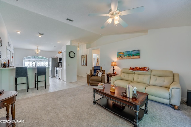 49 Felshire Ln, Palm Coast, FL 32137 - living room with light carpet, vaulted ceiling, and ceiling fan