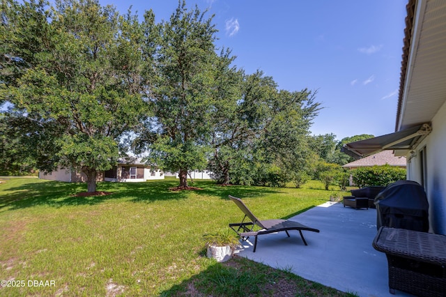 49 Felshire Ln, Palm Coast, FL 32137 - view of grassy yard with a patio area