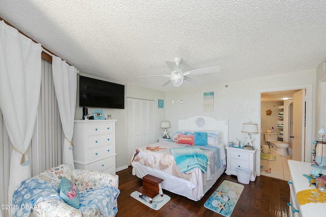 bedroom with a closet, a textured ceiling, a ceiling fan, and wood finished floors